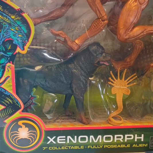 Xenomorph 7-inch collectable figure in its original window box packaging, featuring the black Xenomorph figure alongside orange and green Alien Rex and Alien Centurion monsters.